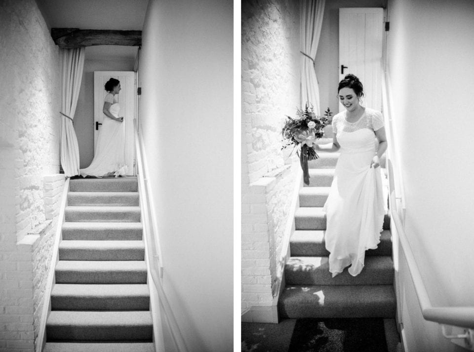 Bury Court Barn wedding - Laura descending the stairs