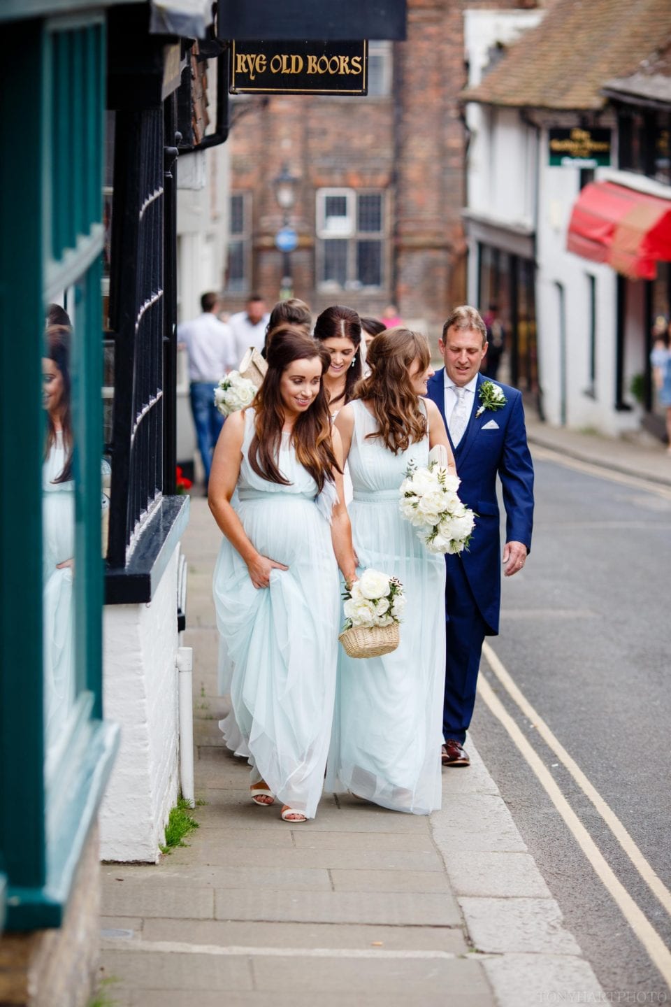 Rachel walking to her wedding through Rye town centre.