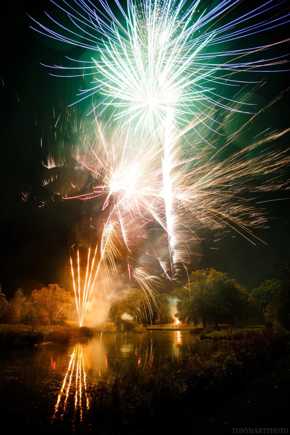 Wedding fireworks reflected in the lake