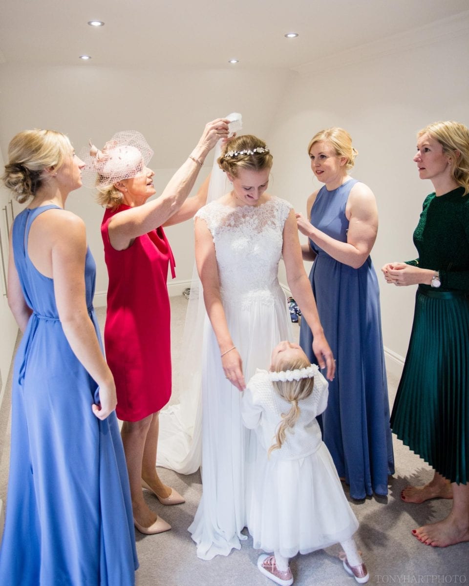 Nicole being helped into her dress