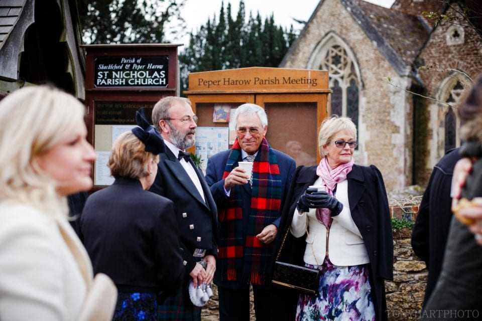 Keeping warm with a coffee outside church