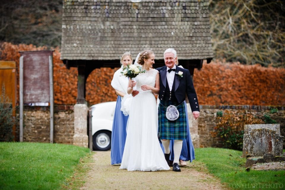 Nicole and her Dad walking down the path to church