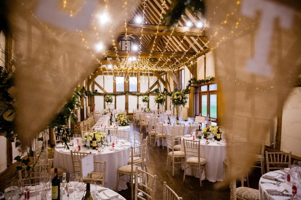 The barn at Loseley Park prepared for the wedding breakfast
