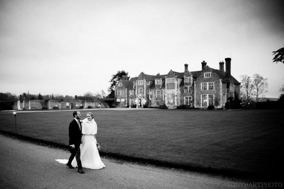 Nicole & Rich during their Winter wedding at Loseley Park