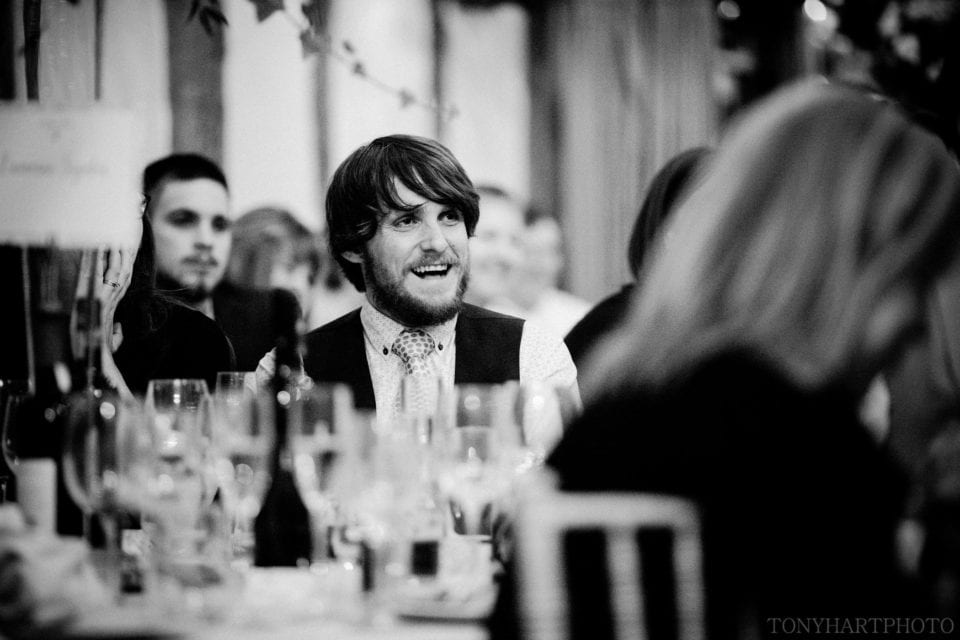 Guest enjoying the speeches in the Barn at Loseley Park