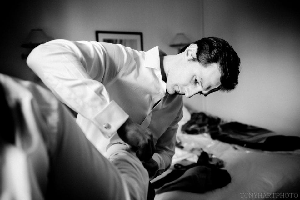 Groomsmen doing shirt cuffs