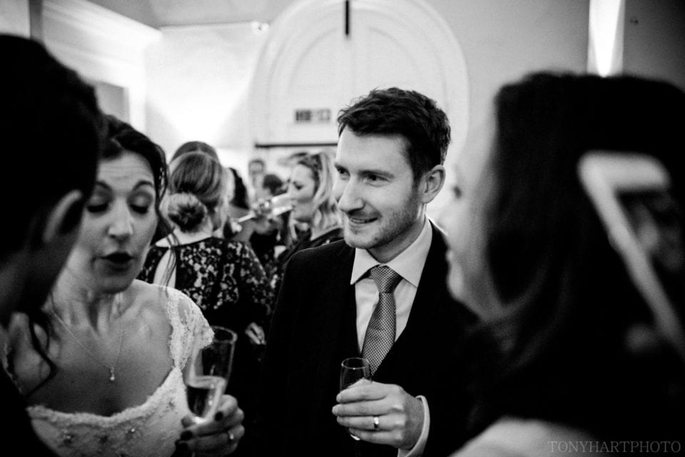 Black and white of the Wedding guests in the Stone Hall