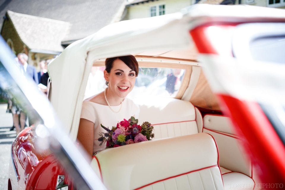 Red piping and cream seats for the wedding car interier