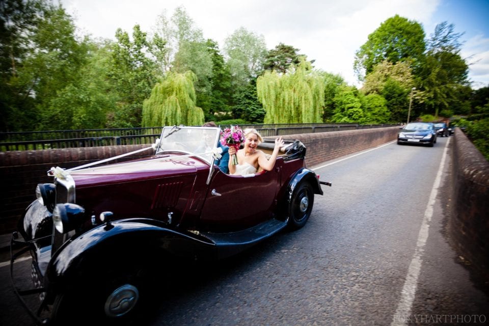 Zoe & Ben making their getaway over Elstead bridge