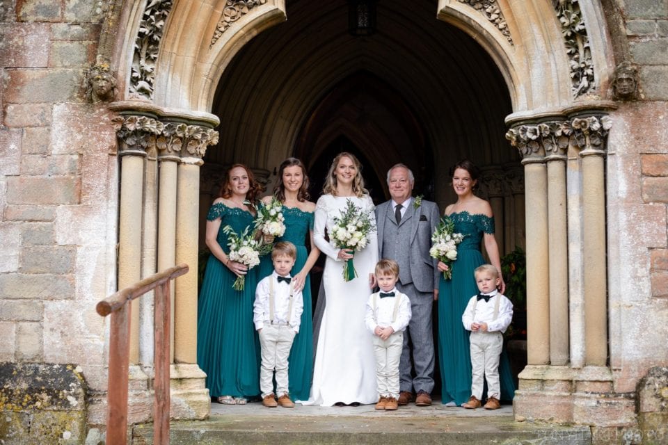 Anna, her bridesmaids, her Dad and the pageboys. The bride wears a Rime Arodaky dress while the bridesmaids wear Whistles maxi dresses.