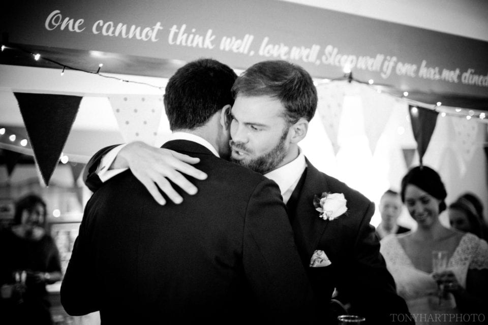 Groom Peter hugs his brother after hearing his best man speech at The Bluebell Dockenfield