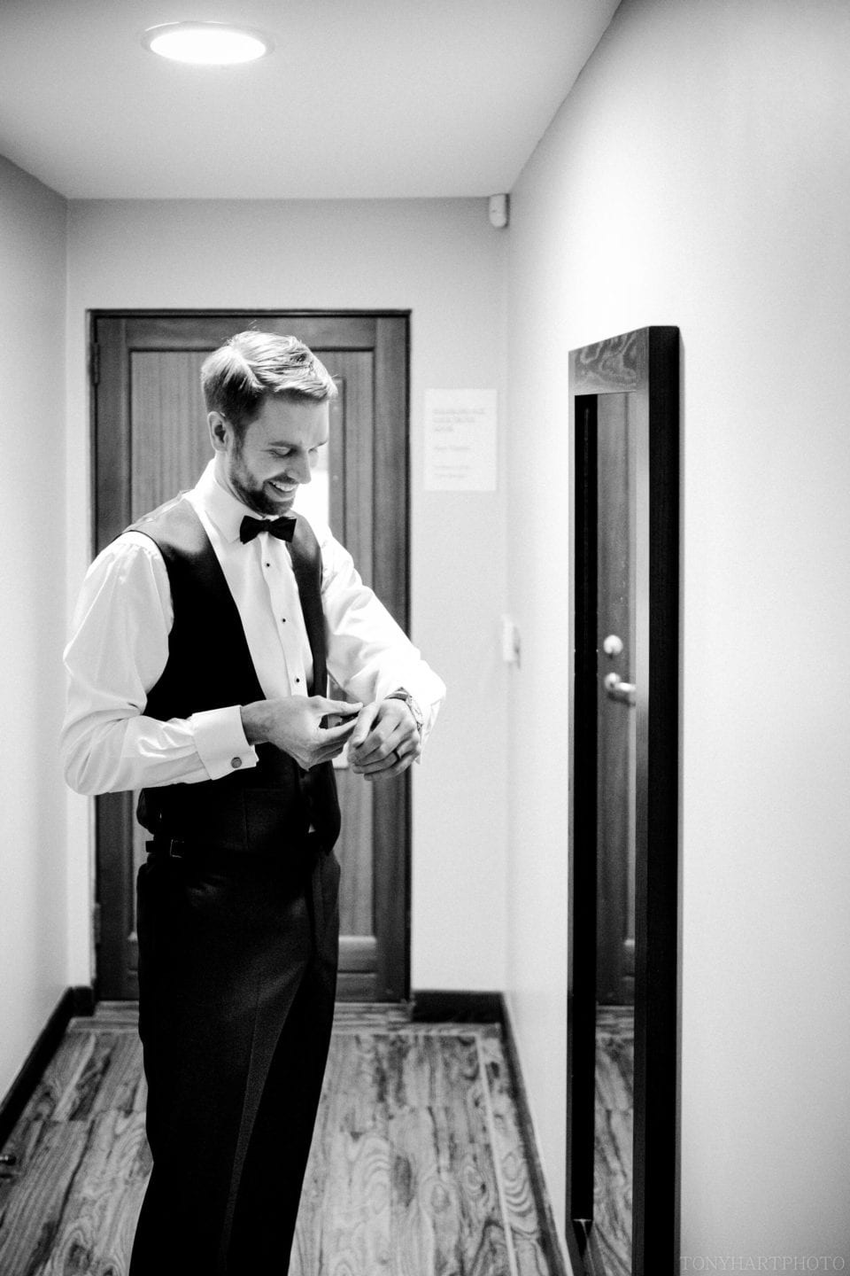 James getting his suit on - Northbrook Park Wedding Photography