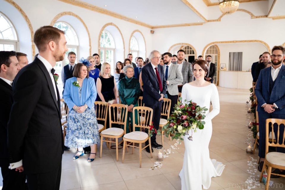 Northbrook Park Wedding Photography - Jemima making her entrance in The Vine Room