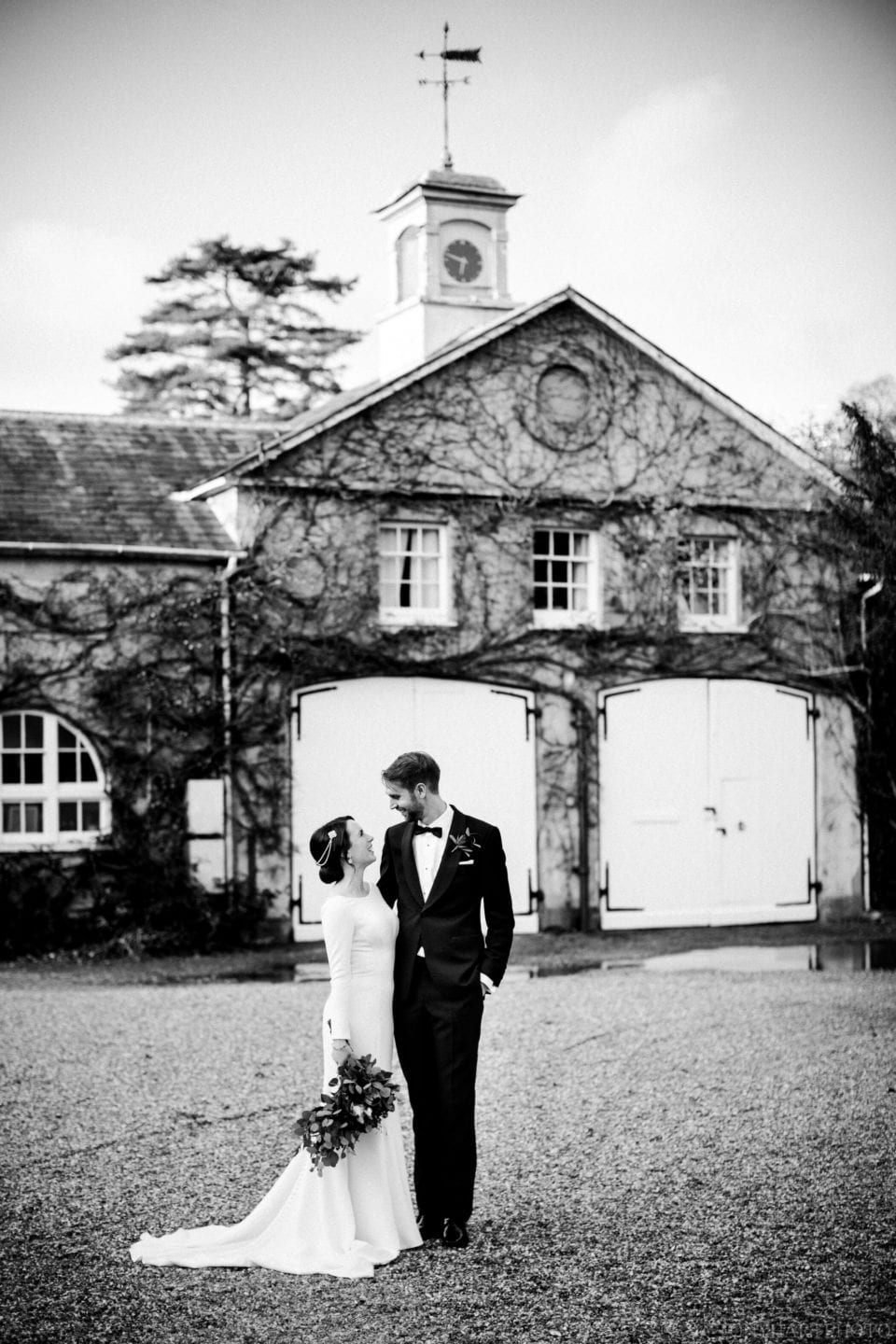 Black and white wedding portrait outside at Northbrook Park