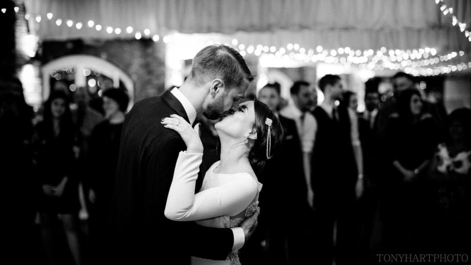 Northbrook Park Wedding Photography - Bride & Groom share a kiss on the dancefloor