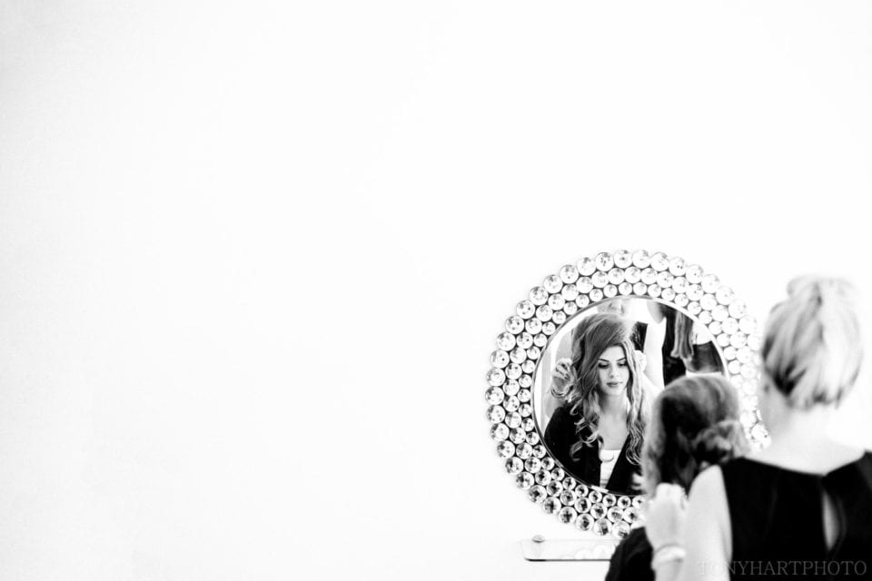 Emma having her makeup done in the bridal prep room at Rivervale Barn