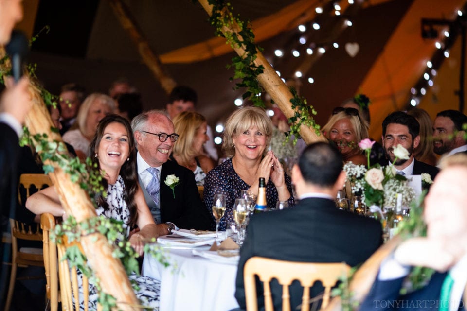 Laughter from the guests during the tipi wedding