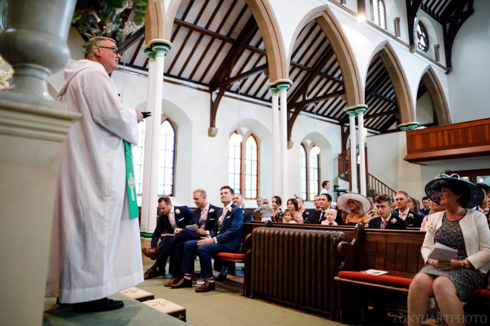 Rev Michael Hopkins greets guests ahead of the wedding ceremony