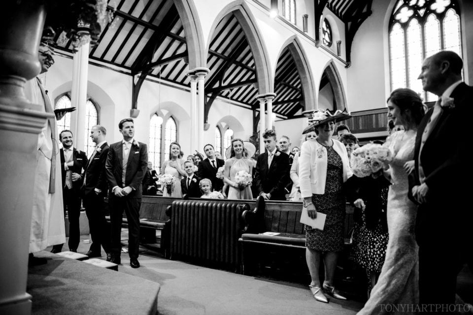 First look at Farnham URC between Bride and Groom
