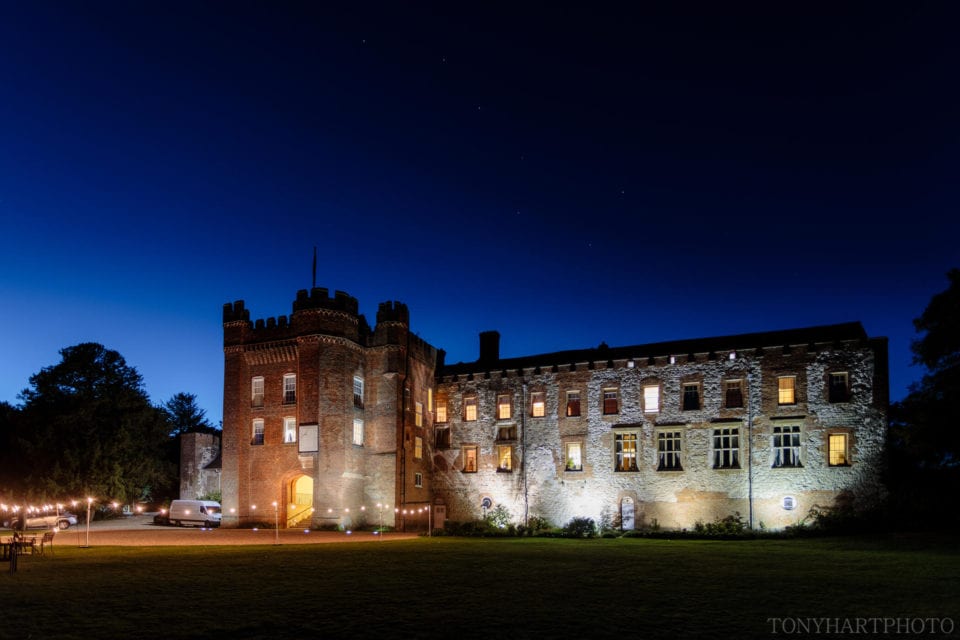 Farnham Castle underneath starry skies.