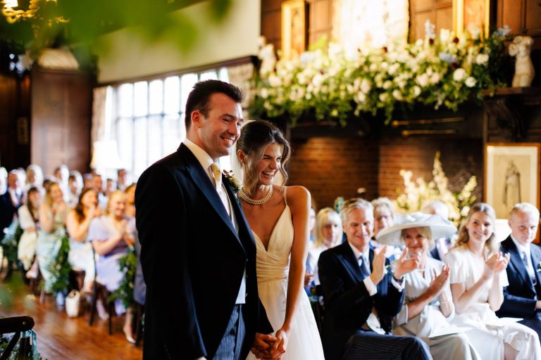 Celia & David smile during their wedding ceremony in The Great Drawing Room at Ramster Hall.