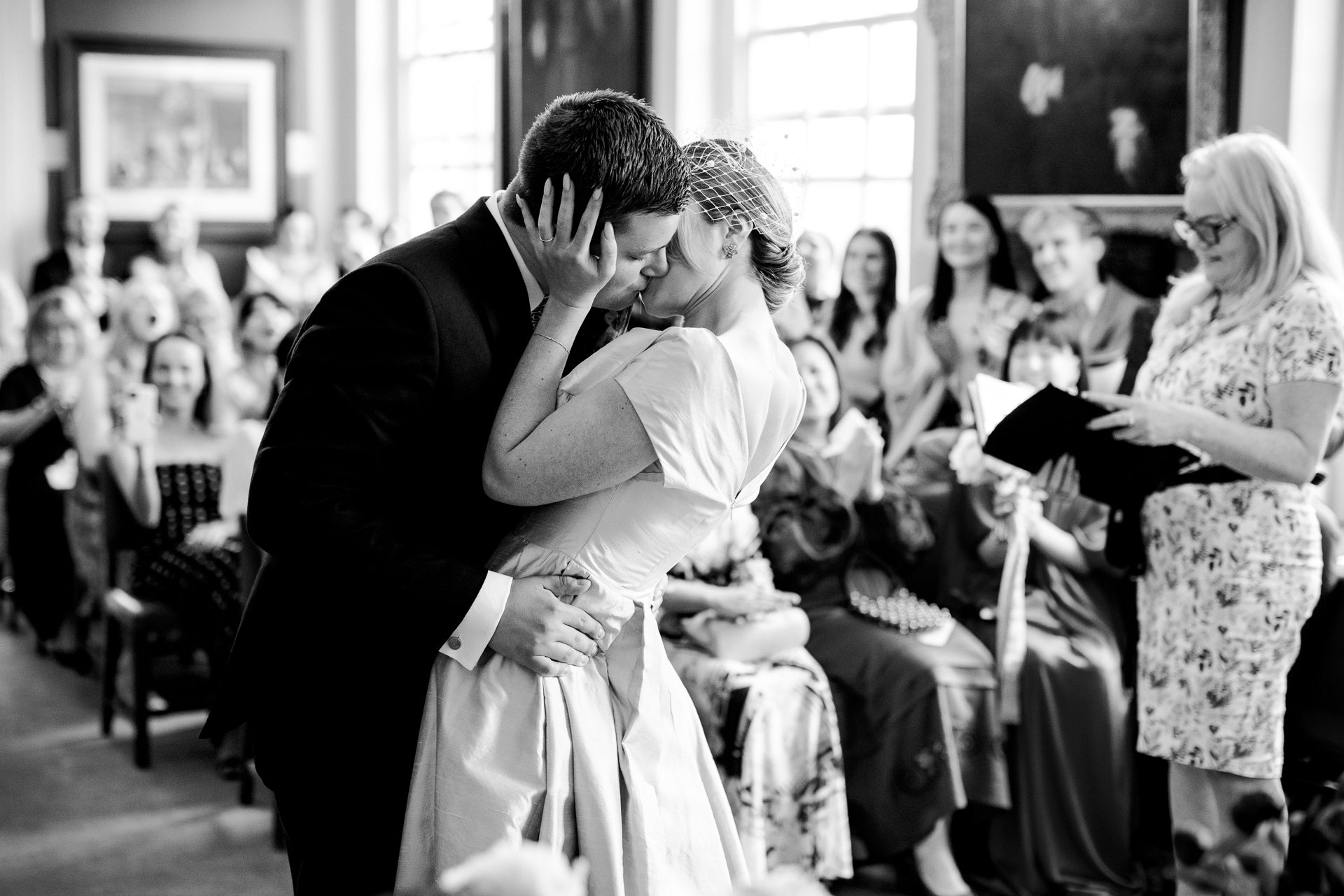 Bride and groom sharing a kiss during their Rye Town Hall ceremony, photographed as part of a The George in Rye wedding.
